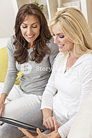 storyblocks-two-beautiful-women-friends-at-home.jpg