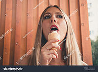 stock-photo-pretty-young-girl-licks-sexual-licking-tongue-by-the-1136036243.jpg