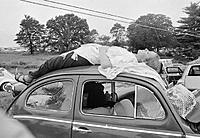 Woman-Sleeping-on-Car-at-Woodstock.jpg