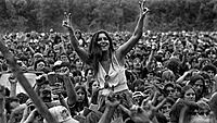 Girl-Enjoying-The-Show-On-The-Shoulders-Of-A-Friend-at-Woodstock.jpg